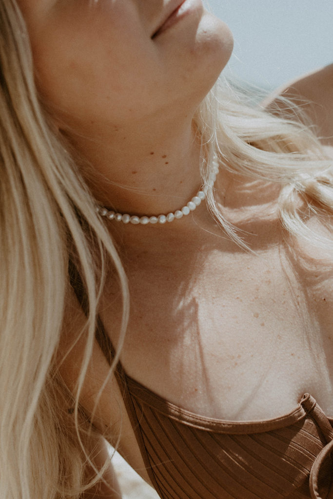 portrait of model wearing saltee hawaii's pearl necklace