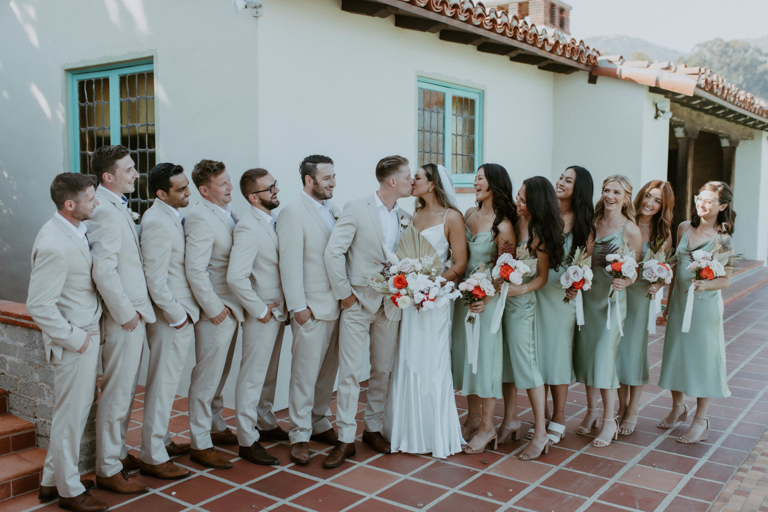 group shot of the bride, groom, groomsmen and bridesmaids