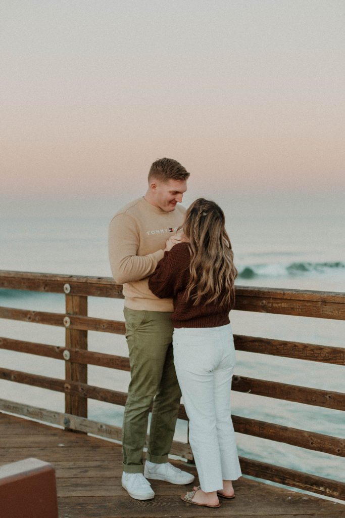 shot of the couple holding eachothers hands to tightly and looking up at each other