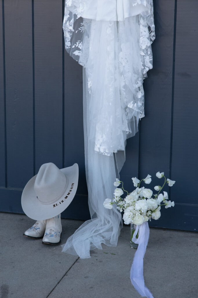 country neutral wedding details of cowgirl bride boots & wedding dress