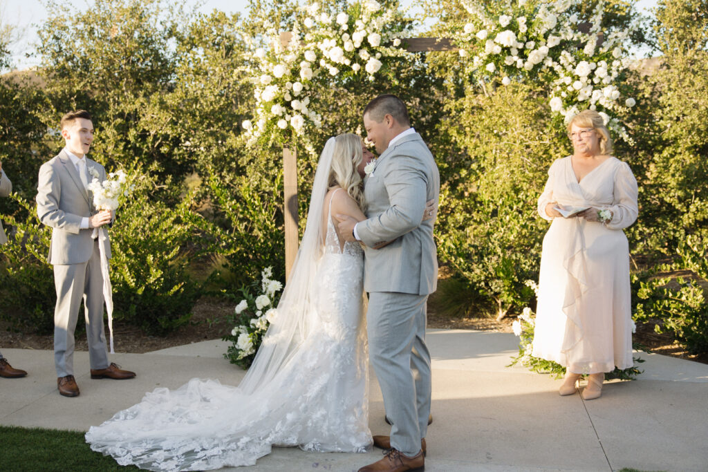 Intimate moment with bride and groom at wedding ceremony 