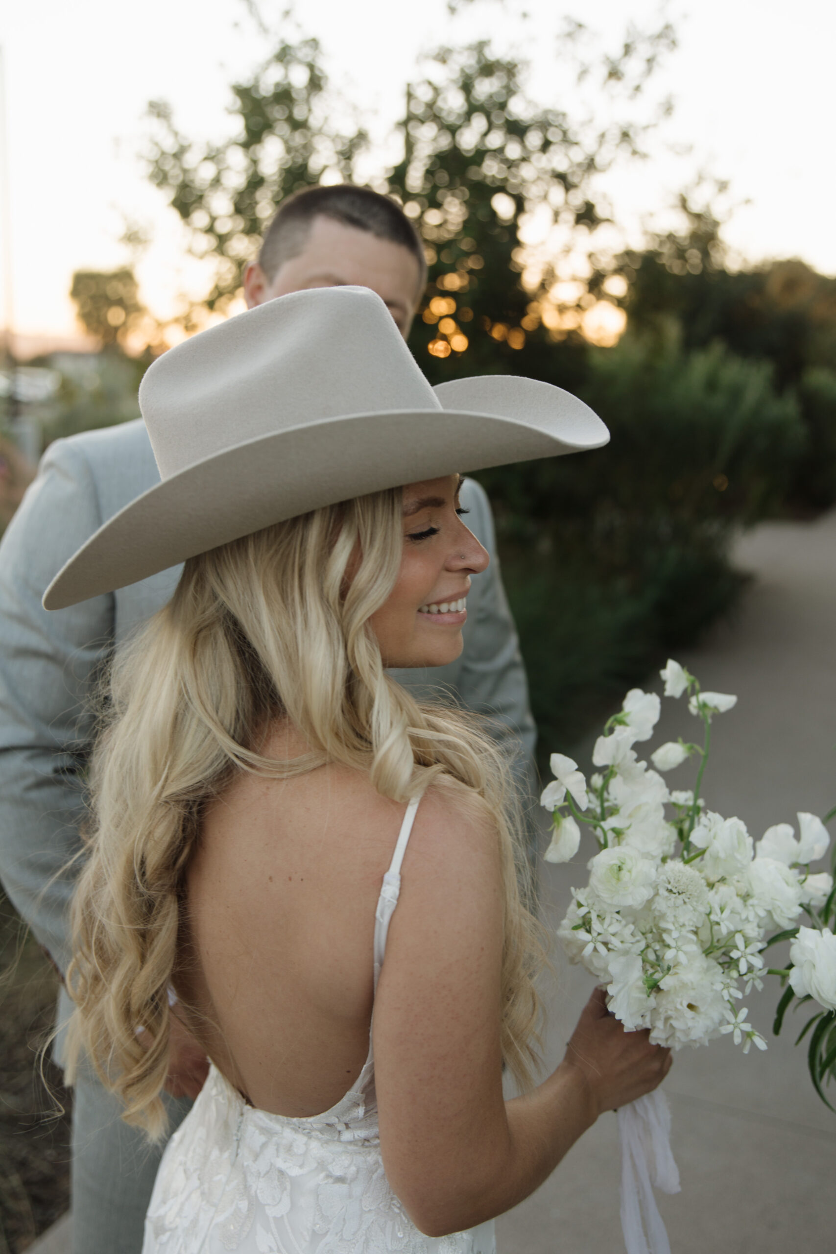 Bride and Groom walking hand-in-hand at a Knoxville outdoor wedding venue