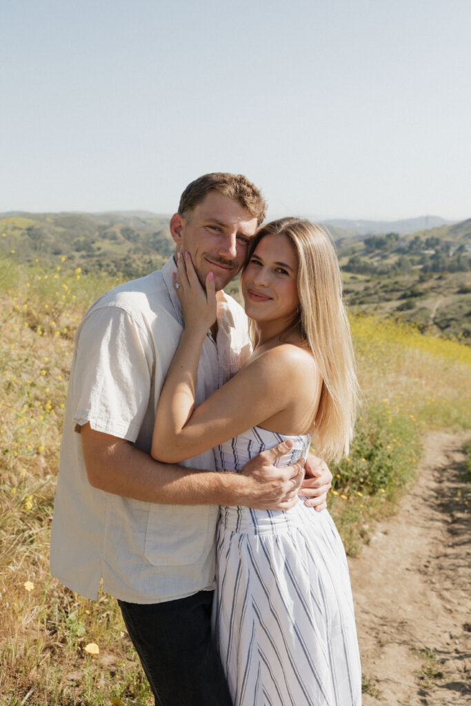 Engagement Photos of couple looking at the camera 