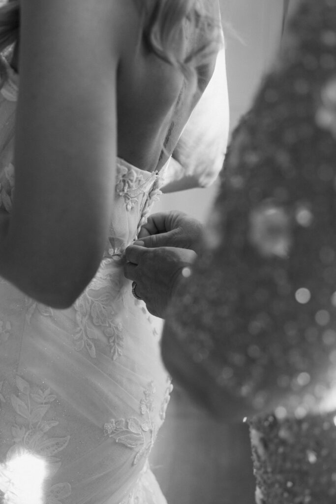 Mother of the bride helping with getting ready