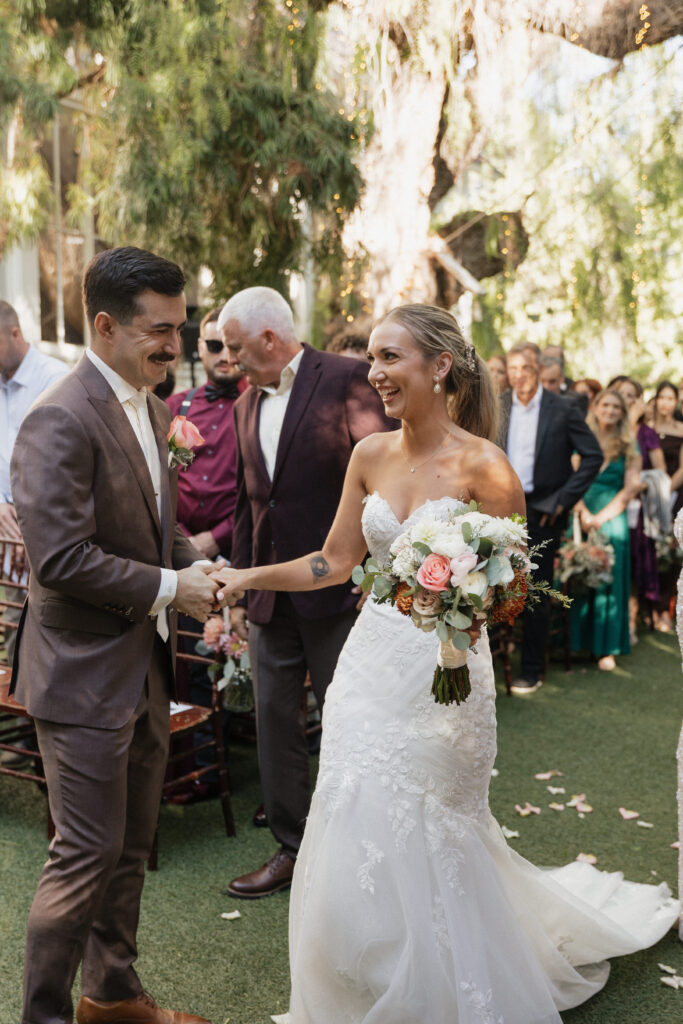 Bride walking down during ceremony at Green Gables wedding venue