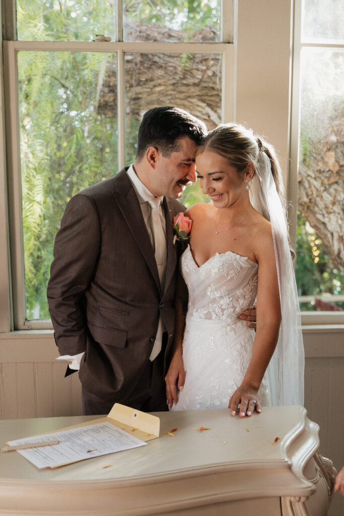 Bride and Groom signing Marriage License